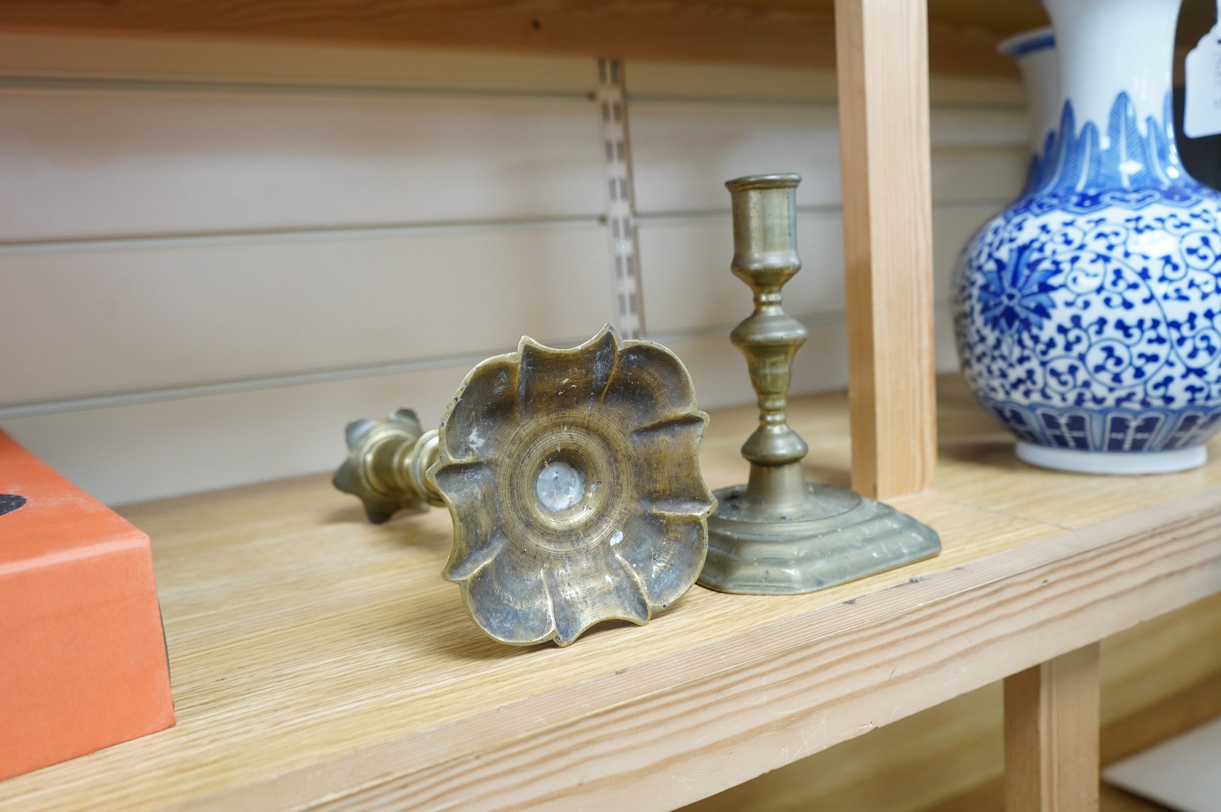 Two 18th century brass candlesticks, largest 23cm high